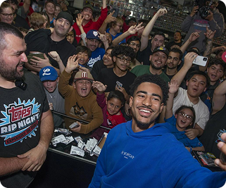 An excited crowd of collectors gathered at a card event